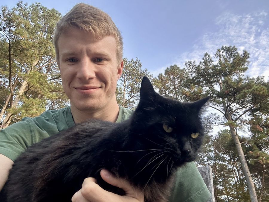 James with his cat outdoors